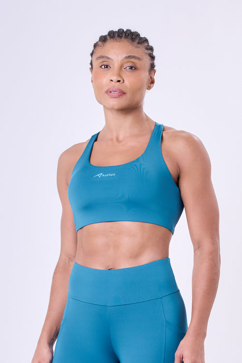 ESSENTIAL RUN STAMINA RACERBACK SPORTS BRA