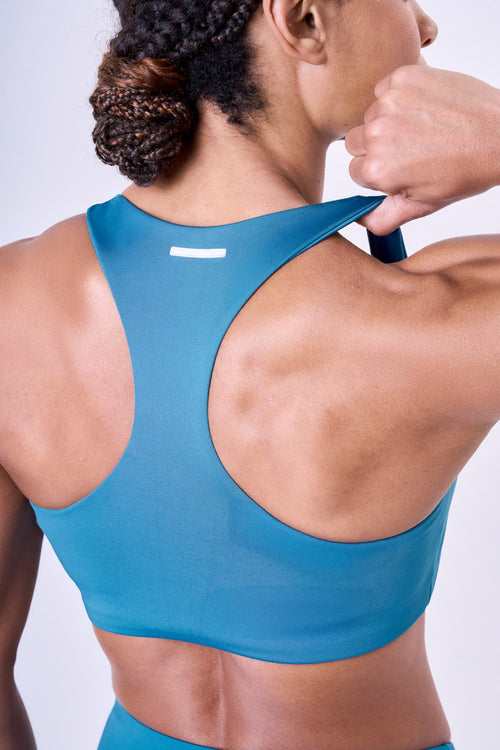 ESSENTIAL RUN STAMINA RACERBACK SPORTS BRA