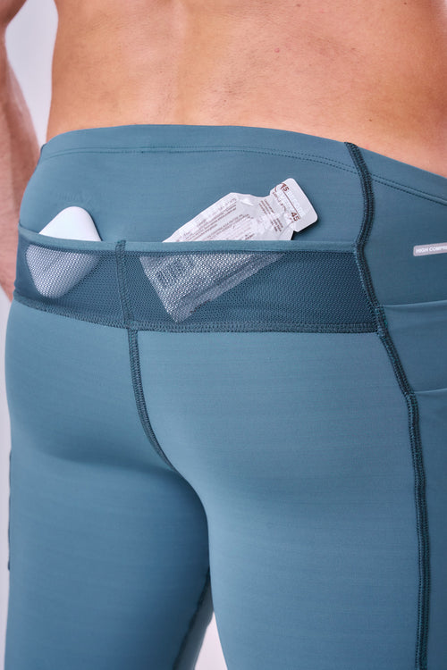 GRIT BOSSA 6-POCKET 9" COMPRESSION SHORTS