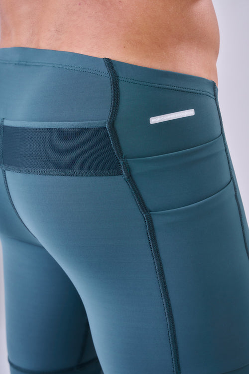 GRIT BOSSA 6-POCKET 9" COMPRESSION SHORTS