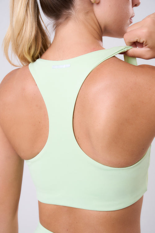 ESSENTIAL RUN STAMINA RACERBACK SPORTS BRA